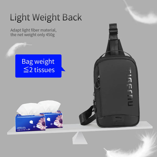 Black sling bag on a gray background with tissue boxes below it
