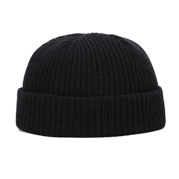Black knit beanie on a white background