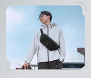 Two individuals wearing crossbody bags with a modern building in the background.