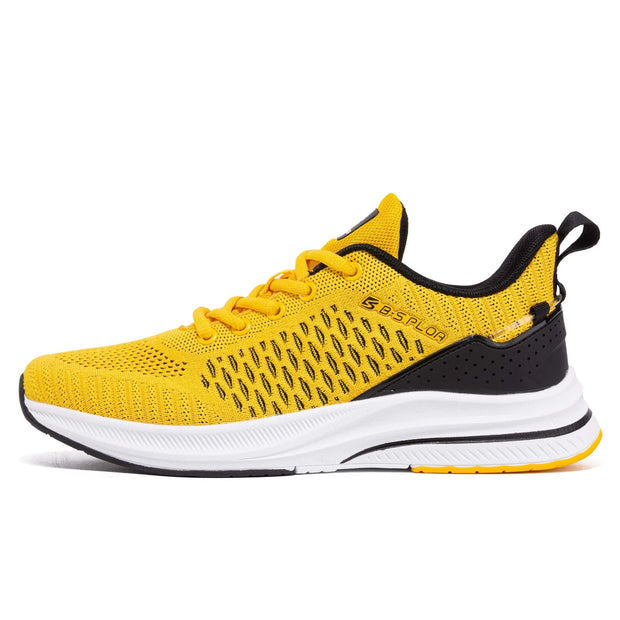 Yellow running shoe with black accents on a white background