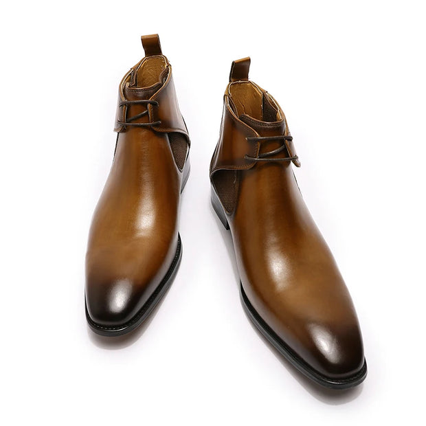 Pair of brown leather boots on a white background