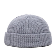 Gray knit beanie on a white background