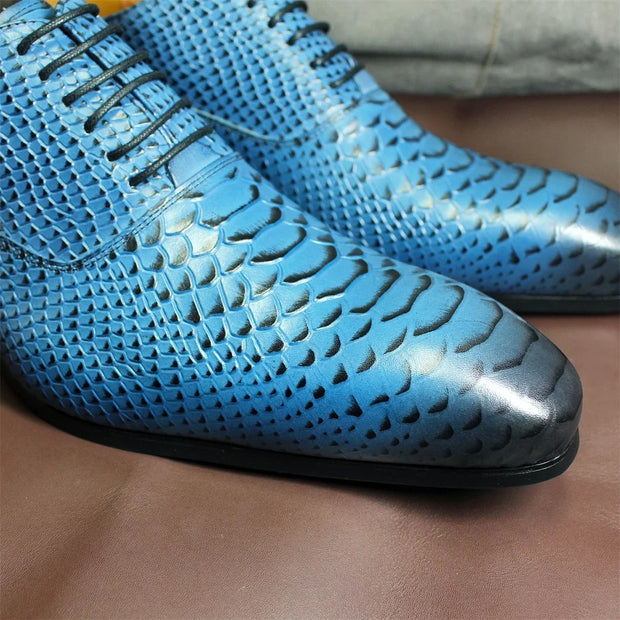Close-up of blue perforated shoes on a brown surface