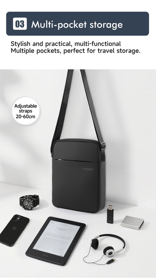 Black crossbody bag with adjustable straps on a white background, featuring multiple pockets and accessories.