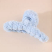 Blue fuzzy hanger on a beige background