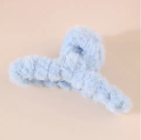 Blue fuzzy hanger on a beige background