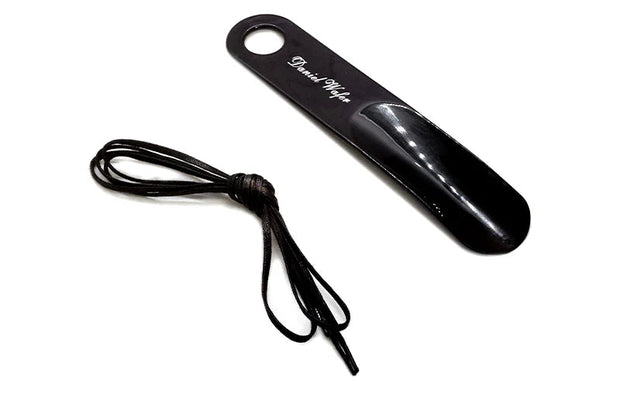 Black hair straightener with a cord on a white background