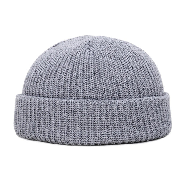 Gray knit beanie on a white background