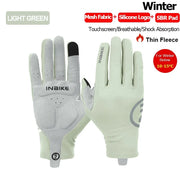 Light green gloves with touchscreen functionality on a white background