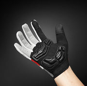Black and gray glove with red accents on a dark background