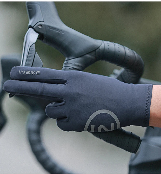 Bicycle handlebar with a gloved hand holding it