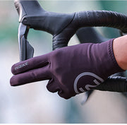 Purple cycling glove on a blurred background