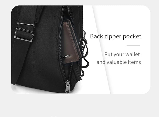 Black backpack with a back zipper pocket on a white background