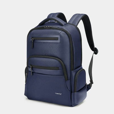 Blue backpack with black zippers on a light gray background