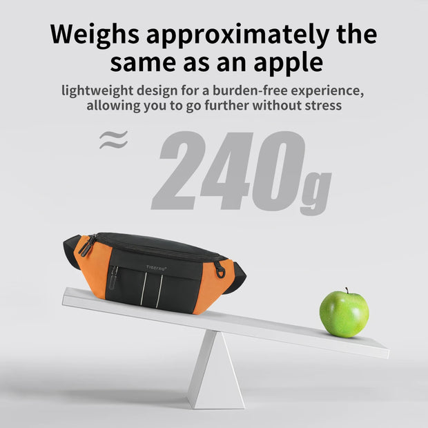 Orange and black waist bag on a scale with a green apple, weighing approximately 240g.