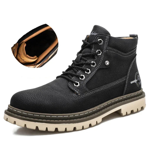 Black leather boot with a close-up of the sole on a white background