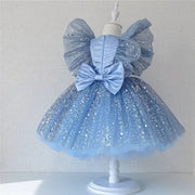Blue glitter dress with a large bow on a mannequin against a white background