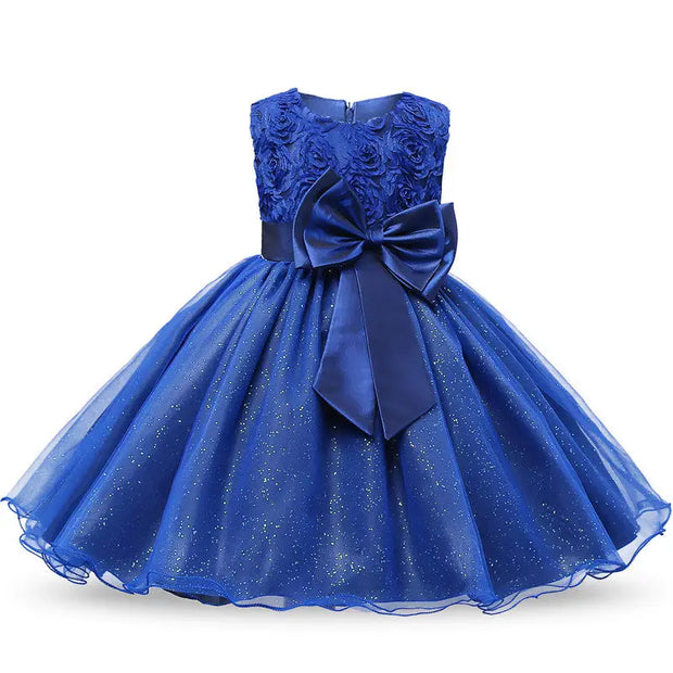 Blue dress with floral top and large bow on a white background