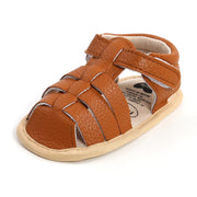 Brown sandal with a white sole on a white background