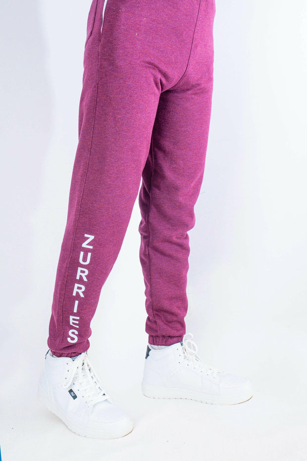 Purple jogger pants with 'Zurries' branding on a white background
