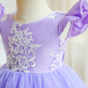 Purple dress with white floral lace on a mannequin against a neutral background