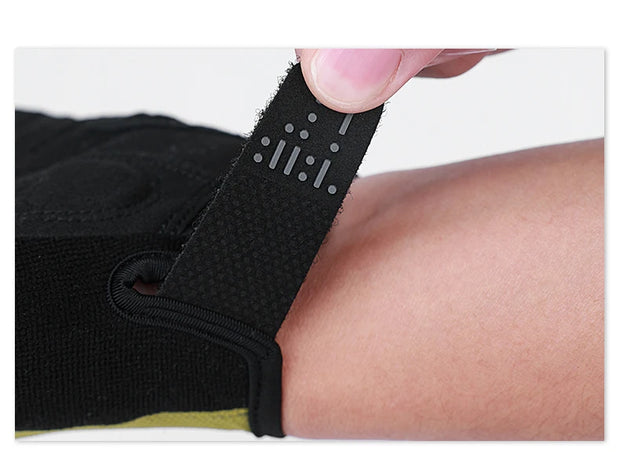 Black athletic brace being worn on a person's leg with a white background
