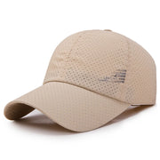 Beige baseball cap with perforated design on a white background