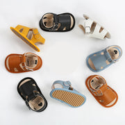 Baby sandals in various colors on a white background 