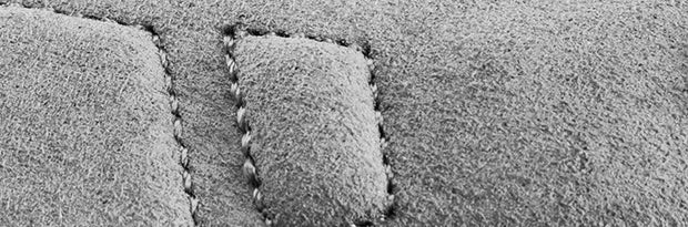 Close-up of a textured surface with a stitched pattern