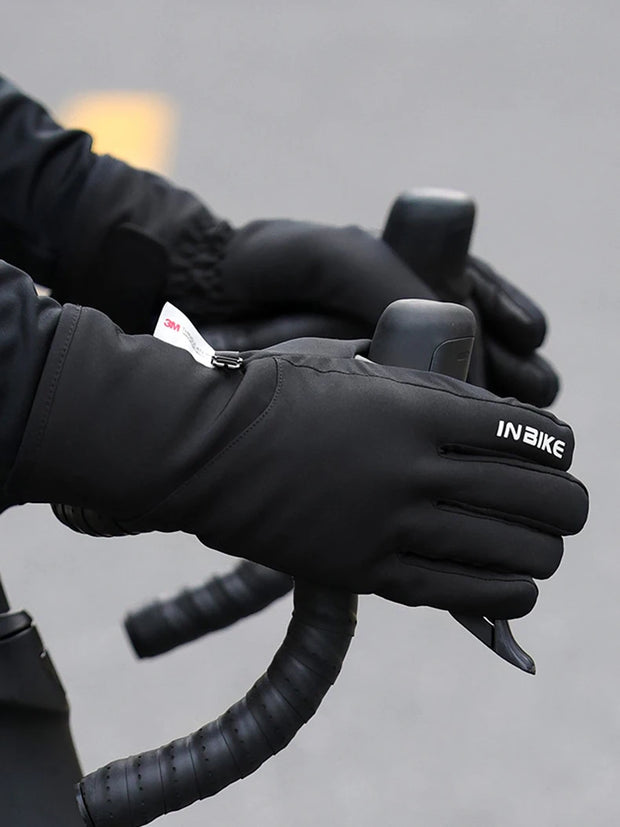 Person wearing black gloves on a blurred background