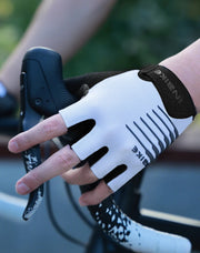White cycling glove with black accents on a blurred background