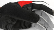 Close-up of a black, red, and white glove on a white background