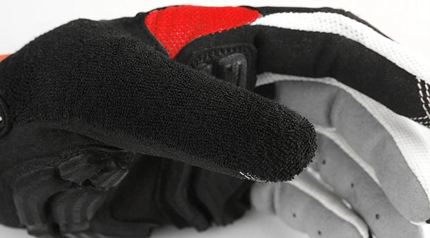 Close-up of a black, red, and white glove on a white background