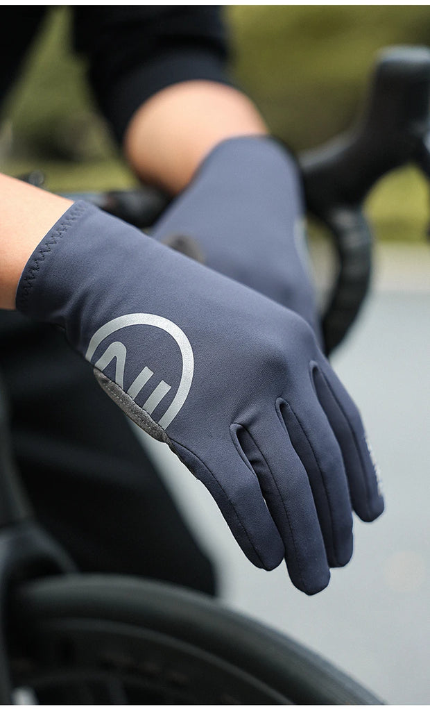 Gray gloves with a logo on a blurred background