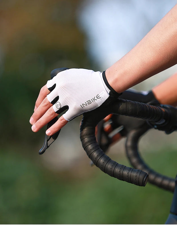 Close-up of a gloved hand on a bicycle handlebar 