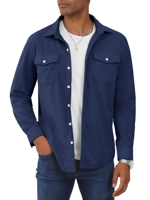 Man wearing a blue corduroy shirt over a white shirt on a white background