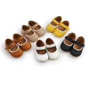 Set of colorful children's shoes on a white background