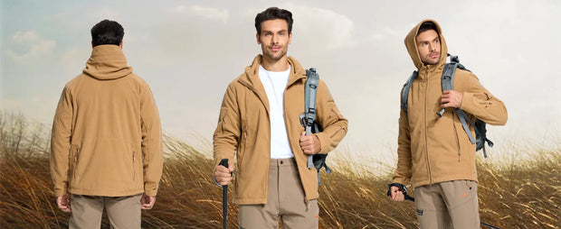 Three men wearing brown jackets in a field with backpacks and walking sticks.
