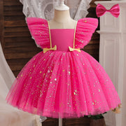 Pink dress with star patterns on a mannequin against a neutral background