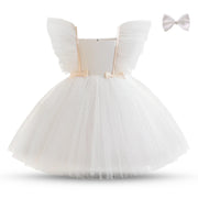 White dress with butterfly wings and a bow on a white background
