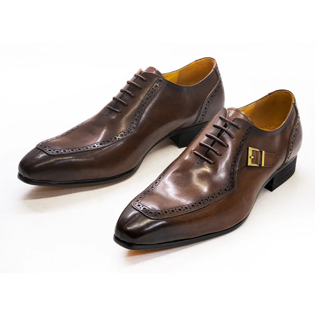 Pair of brown dress shoes on a white background