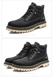 Black leather boots with white soles on a white background