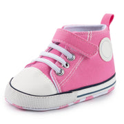 Pink high-top sneaker with white laces on a white background