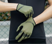Person wearing green cycling gloves 