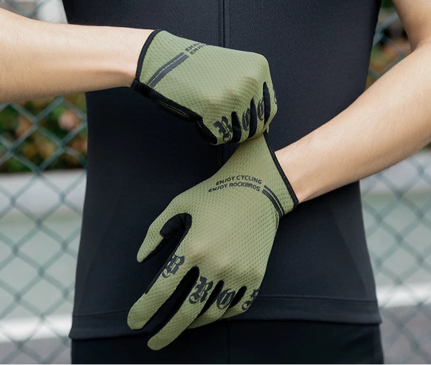 Person wearing green cycling gloves 