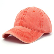 Coral-colored baseball cap on a white background