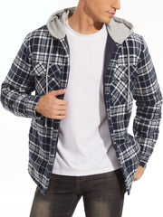 Person wearing a plaid shirt with a hood over a white t-shirt on a white background