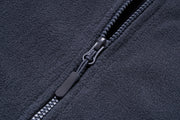Close-up of a zipper on a dark fabric background