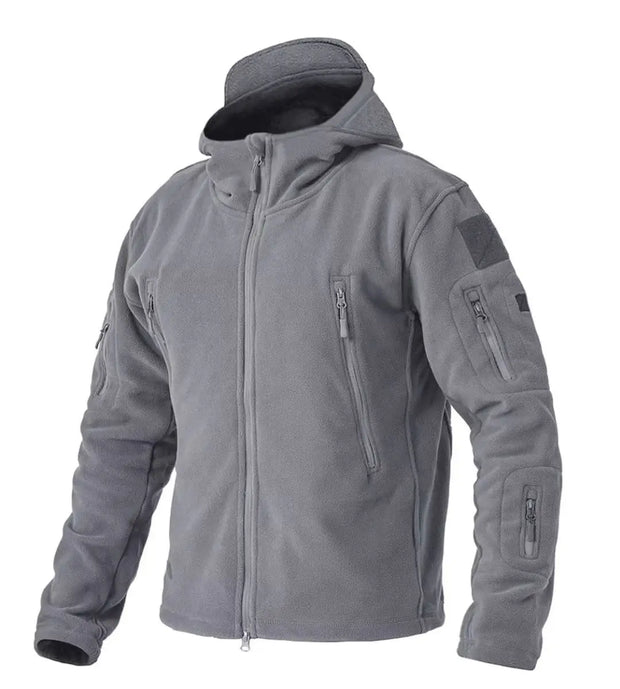 Gray tactical jacket with multiple zippers and patches on a white background