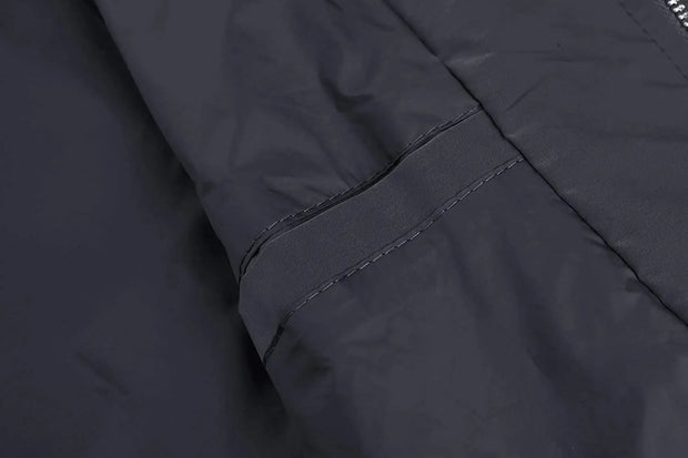 Close-up of a dark gray jacket with stitching detail